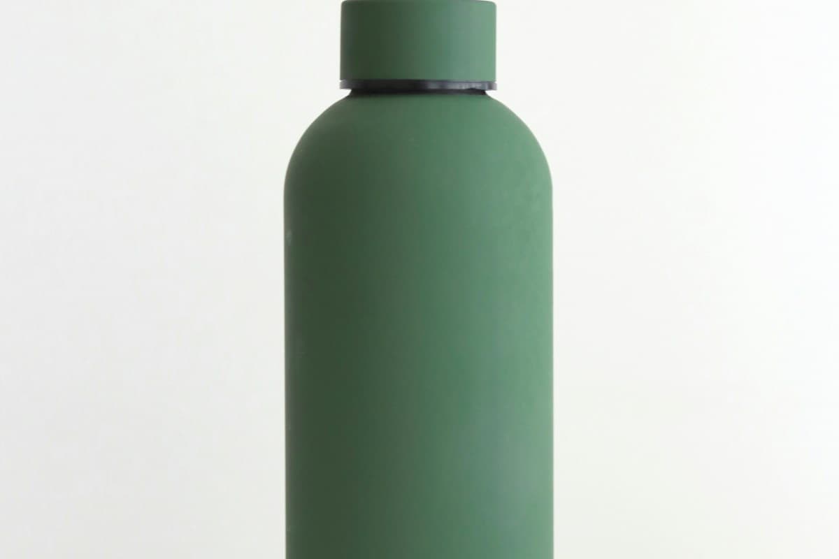 Kinto Day Off insulated travel tumbler in matte sand finish with integrated carry handle